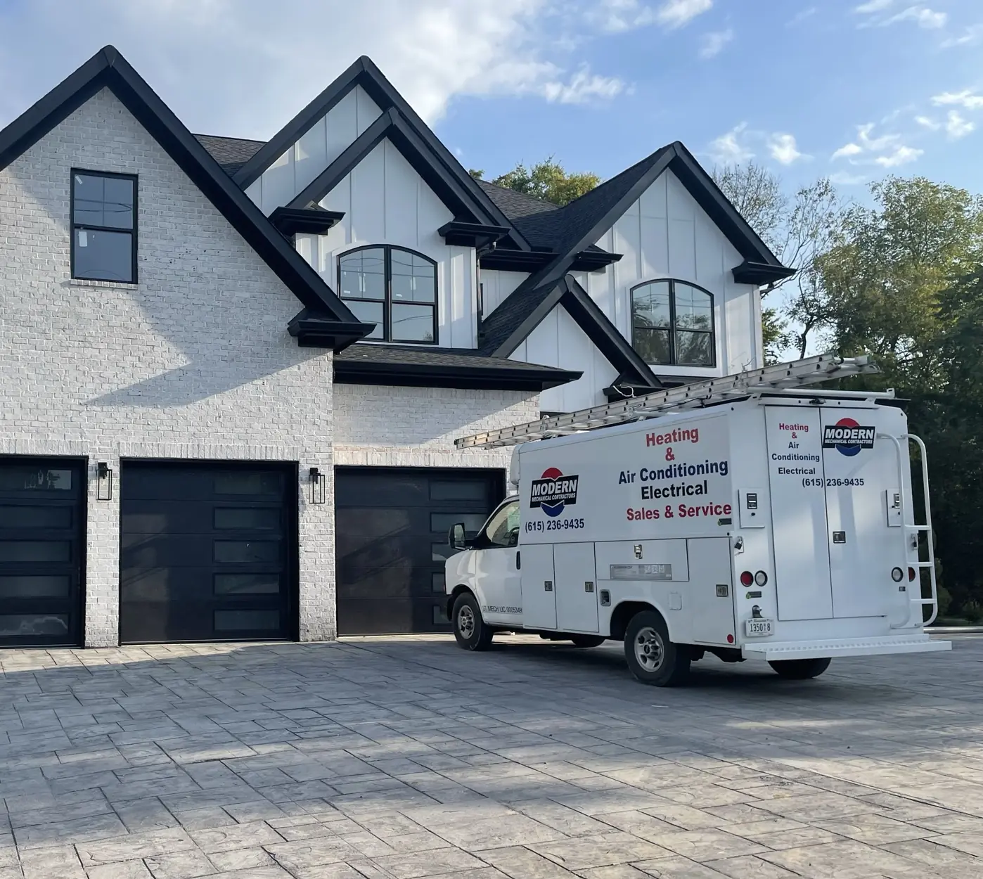 Modern Mechanical Contractors service truck parked at a residential project